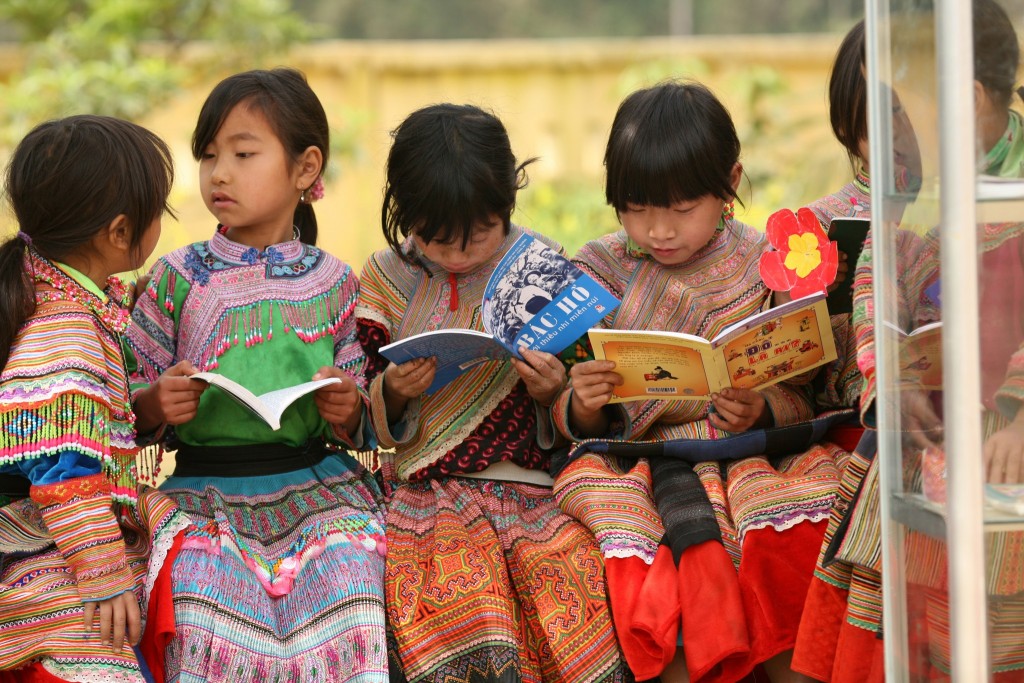 Girls from an indigenous community read outdoors at Ban Pho Primary School in Bac Han District in remote Lao Cai Province in Vietnam. The UNICEF-supported school provides education in a safe, child-friendly learning environment and includes classes taught in the children’s indigenous language.